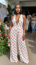 Cherry print halter wide-leg jumpsuit by My Store, featuring a fitted bodice and flowing wide-leg pants in vibrant cherry pattern.