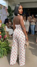 Cherry print halter wide-leg jumpsuit by My Store, featuring a stylish halter neckline and flowy wide-leg pants.
