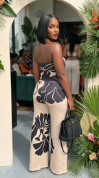 Midnight Bloom halter jumpsuit by My Store, featuring a stylish black design with a halter neckline and flowing wide-leg pants.