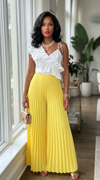 Deme & Anor cami jumpsuit with asymmetrical ruffle detail, pleated bottom, and sleeveless design on a mannequin.