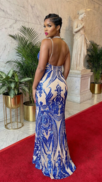 Deme & Anor The Grand Entrance Art Deco Maxi Dress displayed on a mannequin, featuring elegant geometric patterns and a flowing silhouette.